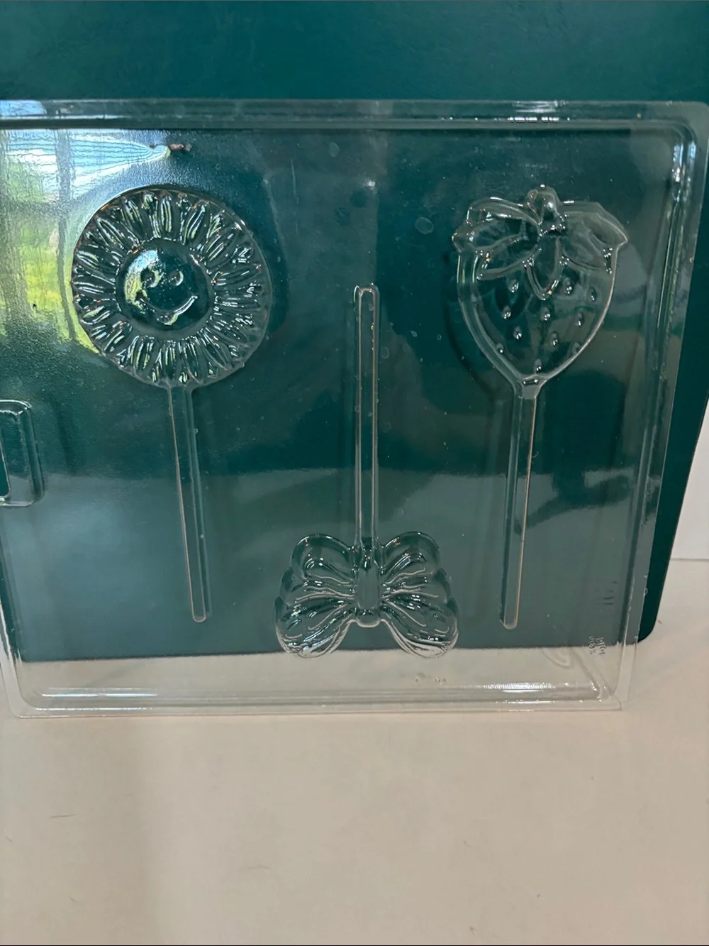 Wilton Clear Candy Mold Set with stars, shells, flowers.